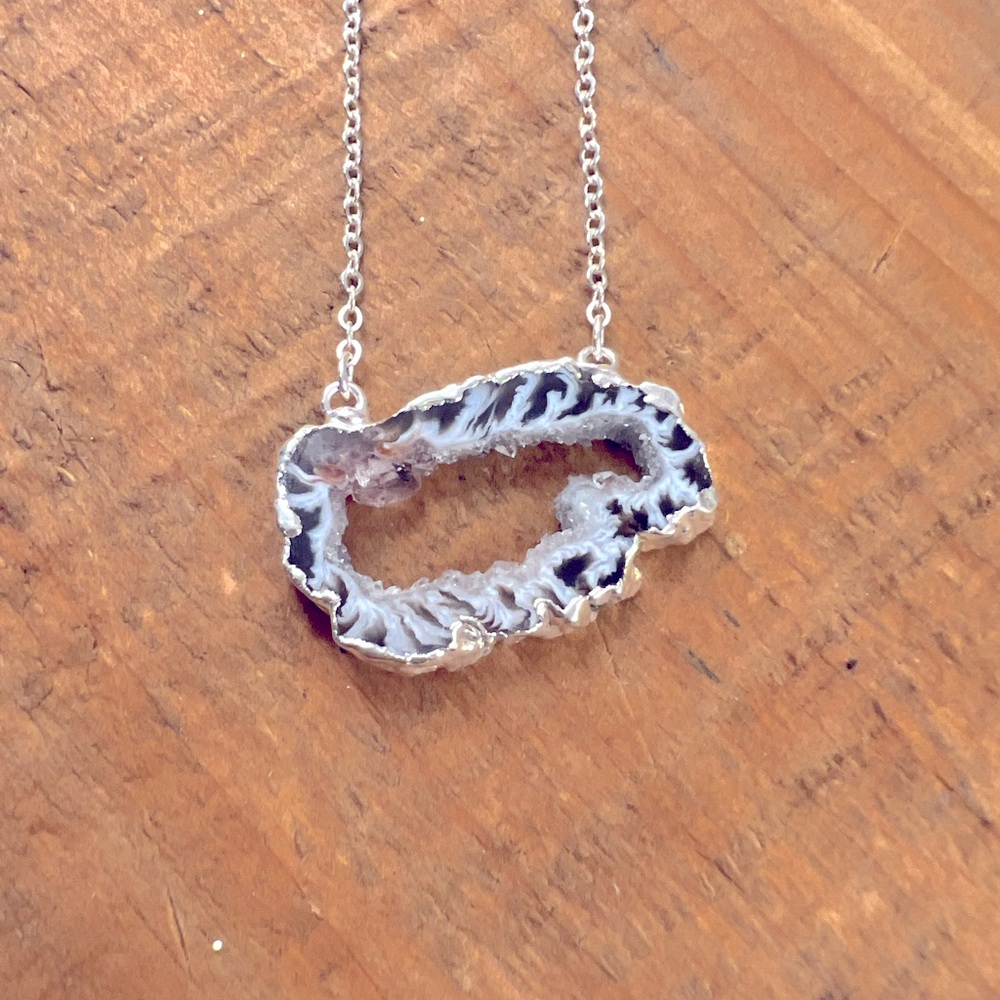 Handmade Agate slice necklace with silver plate on a plated chain.